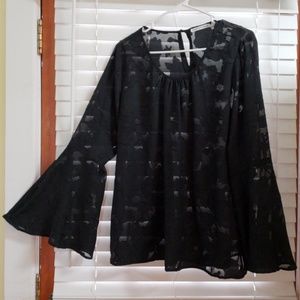 Sheer black top with floral pattern